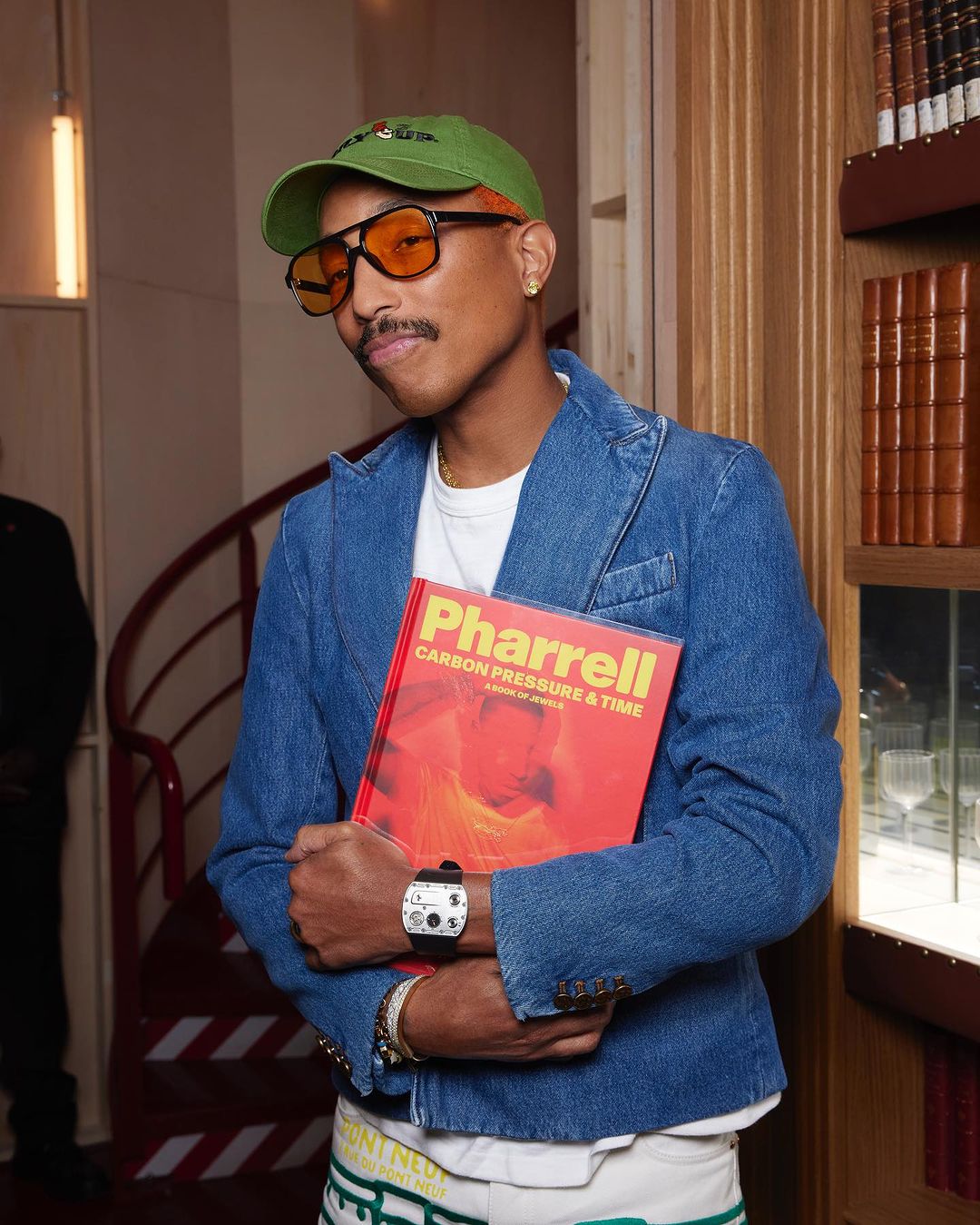 Pharrell in Paris wearing a full Louis Vuitton monogram biker