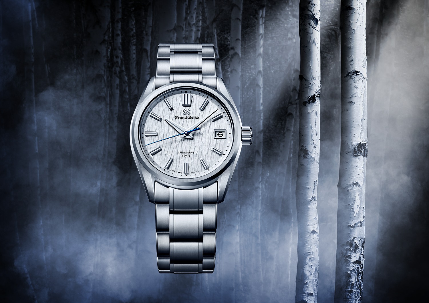 Grand Seiko White Birch SLGA009 on a steel bracelet against a birch-inspired background